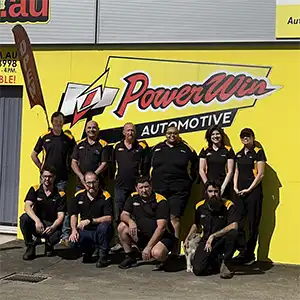 Team in front of Powerwin Automotive building